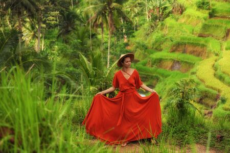 Woman walking on Tegalalang Rice Terrace, Baliの写真素材