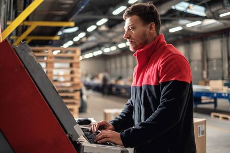 Courier picks up package on a warehouse