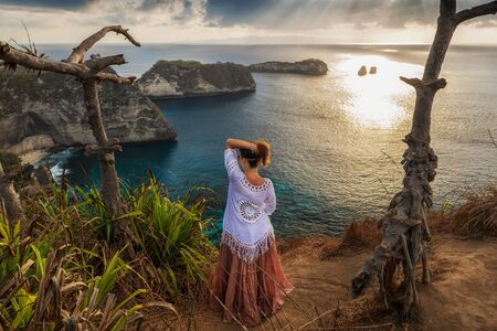 Woman enjoying view of Diamond Bay, Nusa Penida island, Indonesia.
