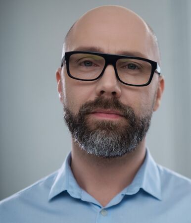 Bearded middle-aged man wearing glassesの写真素材