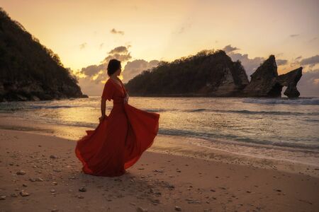 Woman at Atuh beach at Nusa Penida Island, Bali, Indonesia.の写真素材