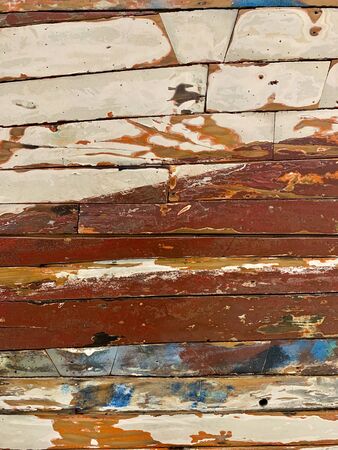 Colourful wooden planks wall texture.