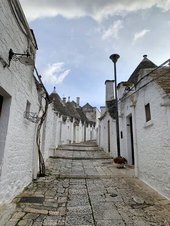 Walking streets of trulli town Alberobello, Italyの写真素材