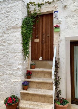 Walking charming white streets of Locorotondo in Puglia, Italy.の写真素材
