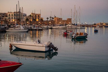 Old fishing boats in Bari, Italy.の写真素材