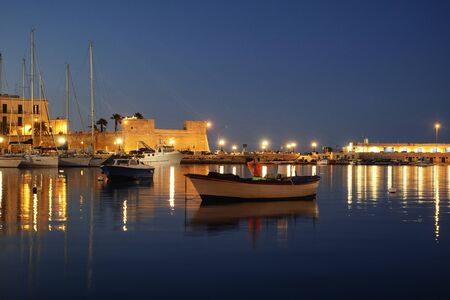 Old fishing boats in Bari, Italy.の写真素材