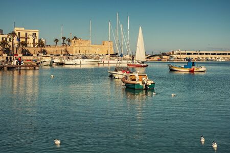 Old fishing boats in Bari, Italy.の写真素材