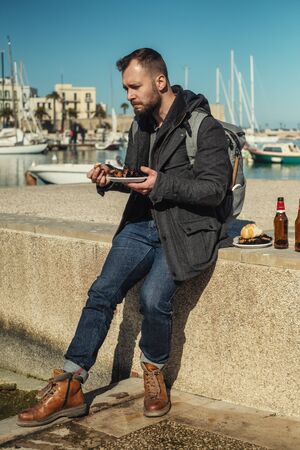 Man eating sea urchins caviar in Bari, Italyの写真素材