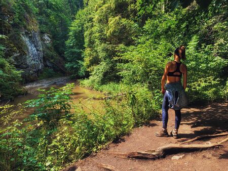 Fit woman in a Slovensky Raj, Tatra mountains, Slovakiaの写真素材