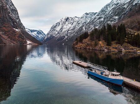 Fishing boat in Naeroyfjord in Gudvangen village, Norway.の写真素材