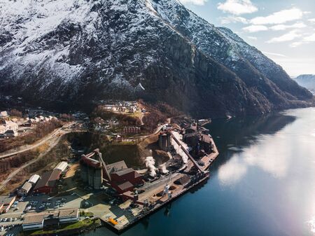 Illmenite smelter at shore of fjord, Tyssedal, Norway.の写真素材