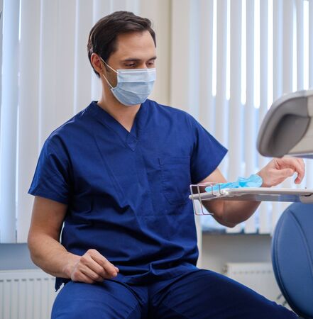 Doctor wearing protective mask in a hospitalの写真素材