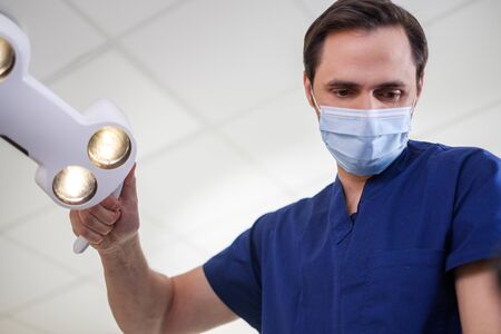 Doctor wearing protective mask in a hospitalの写真素材