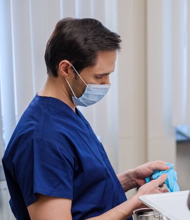 Doctor wearing protective mask in a hospitalの写真素材