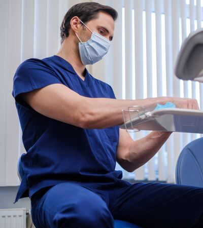 Doctor wearing protective mask in a hospitalの写真素材
