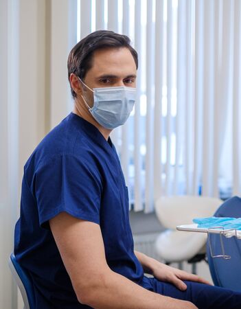 Doctor wearing protective mask in a hospitalの写真素材