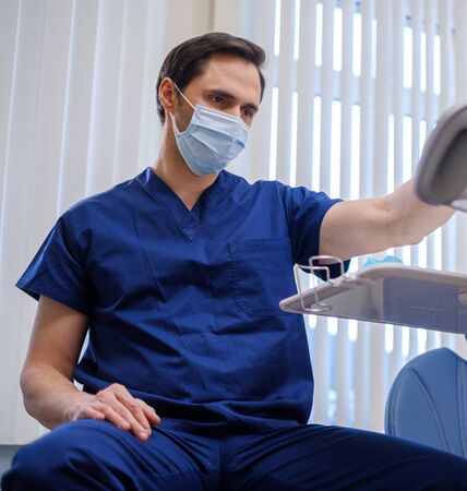 Doctor wearing protective mask in a hospitalの写真素材
