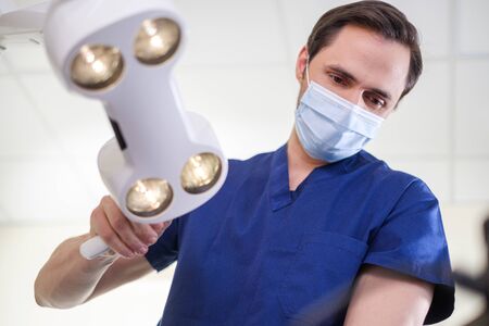 Doctor wearing protective mask in a hospitalの写真素材