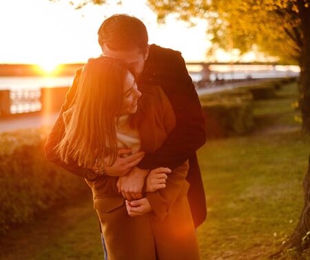 Lovely couple on a sunsetの写真素材