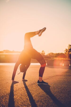 Body positive woman doing fitness exercise outdoorの写真素材