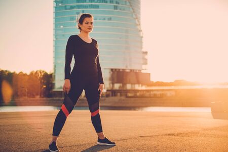 Body positive woman doing fitness exercise outdoorの写真素材