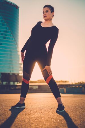 Body positive woman doing fitness exercise outdoorの写真素材
