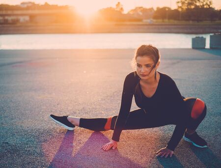 Body positive woman doing fitness exercise outdoorの写真素材