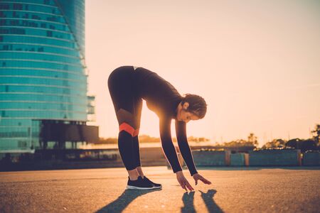 Body positive woman doing fitness exercise outdoorの写真素材
