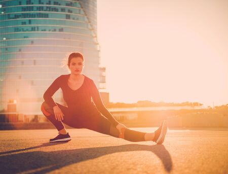 Body positive woman doing fitness exercise outdoorの写真素材