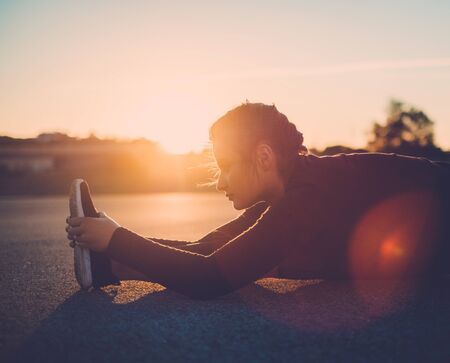 Body positive woman doing fitness exercise outdoorの写真素材