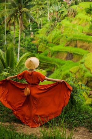 Woman walking on Tegalalang Rice Terrace, Baliの写真素材