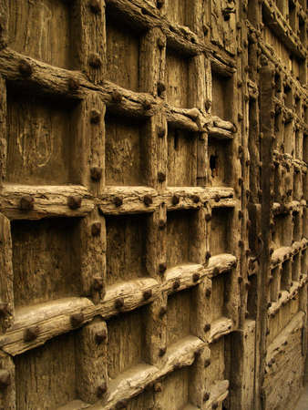 Medieval castle gate detail with iron reinforcementsの写真素材