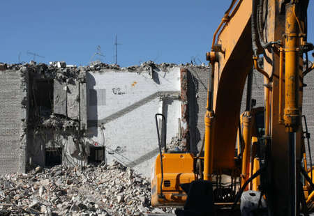Dredge doing demolition of building in the city centerの写真素材