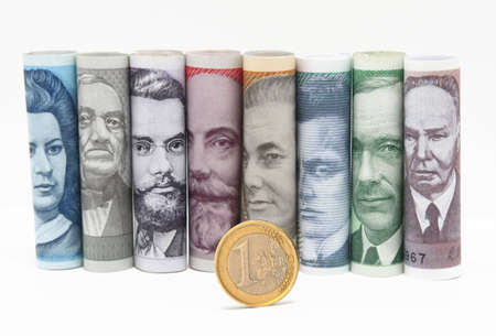 Estonian paper money and one euro coinの写真素材