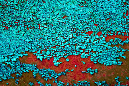 cracked paint on the metal surfaceの写真素材