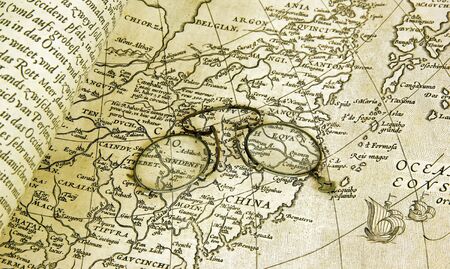 besicle, opera glasses on map of 17 th centuryのeditorial素材