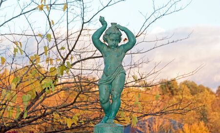 Cherub fountain, fountain of ten ninth century and wintry landscapeの写真素材