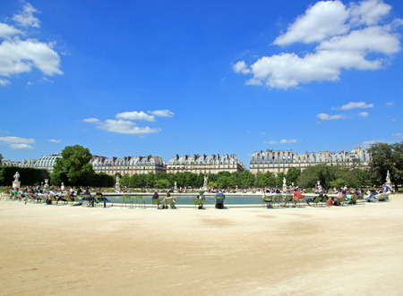 Sunbathing around a basin of Jardin des Tuileries Paris Franceのeditorial素材