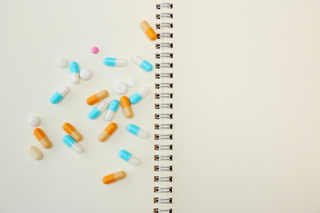 Drugs on a bookの写真素材