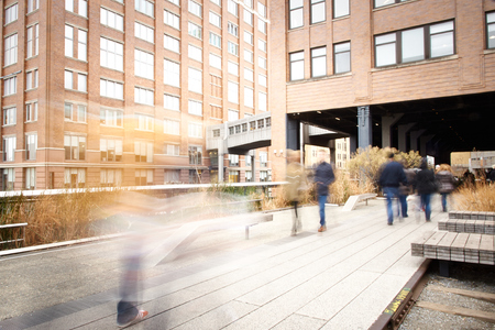 People relaxing and strolling on The High Line. The High Line is a recently created New York City park located on what used to be an elevated industrial railroad line. It is located in the meatpacking district on the west side of Manhattan. It stretches fのeditorial素材