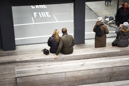 People relaxing and strolling on The High Line. The High Line is a recently created New York City park located on what used to be an elevated industrial railroad line. It is located in the meatpacking district on the west side of Manhattan. It stretches fのeditorial素材