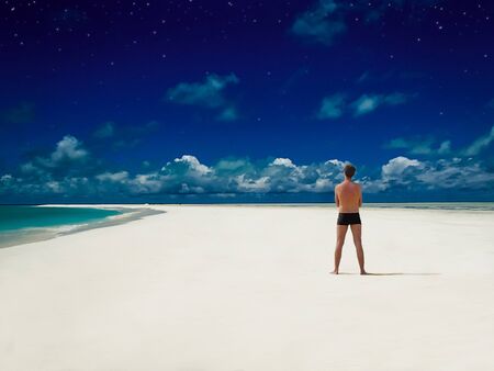 Young man at perfect beachの素材