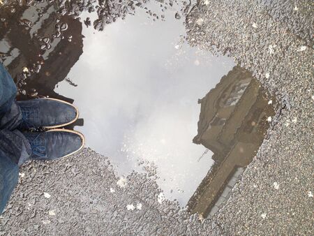 Standing next to a puddle In londonの素材
