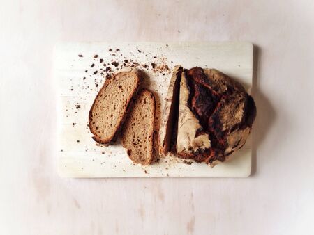 Farmhouse bread on wooden board 