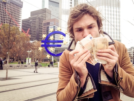 Man with banknotes in Frankfurt の素材