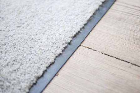 white carpet on wooden floorの写真素材