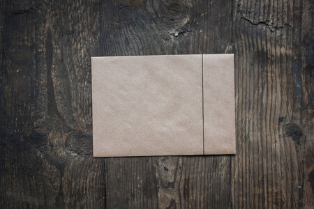 brown envelope on wooden backgroundの写真素材