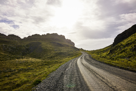 Patagonian road and hills in horizon. Diminishing perspective. Wide shot.の写真素材