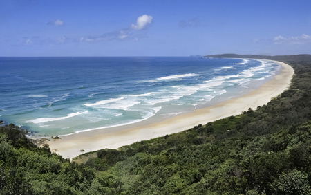 Australian seacoast panorama of pristine sandy beaches with blue water and sky.の写真素材