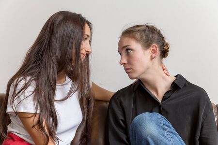 Friend Comforting Sad Girlfriend with Smile